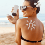 Woman Applying Sun Cream on Tanned Shoulder