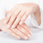 woman hands applying moisturizing cream to her skin