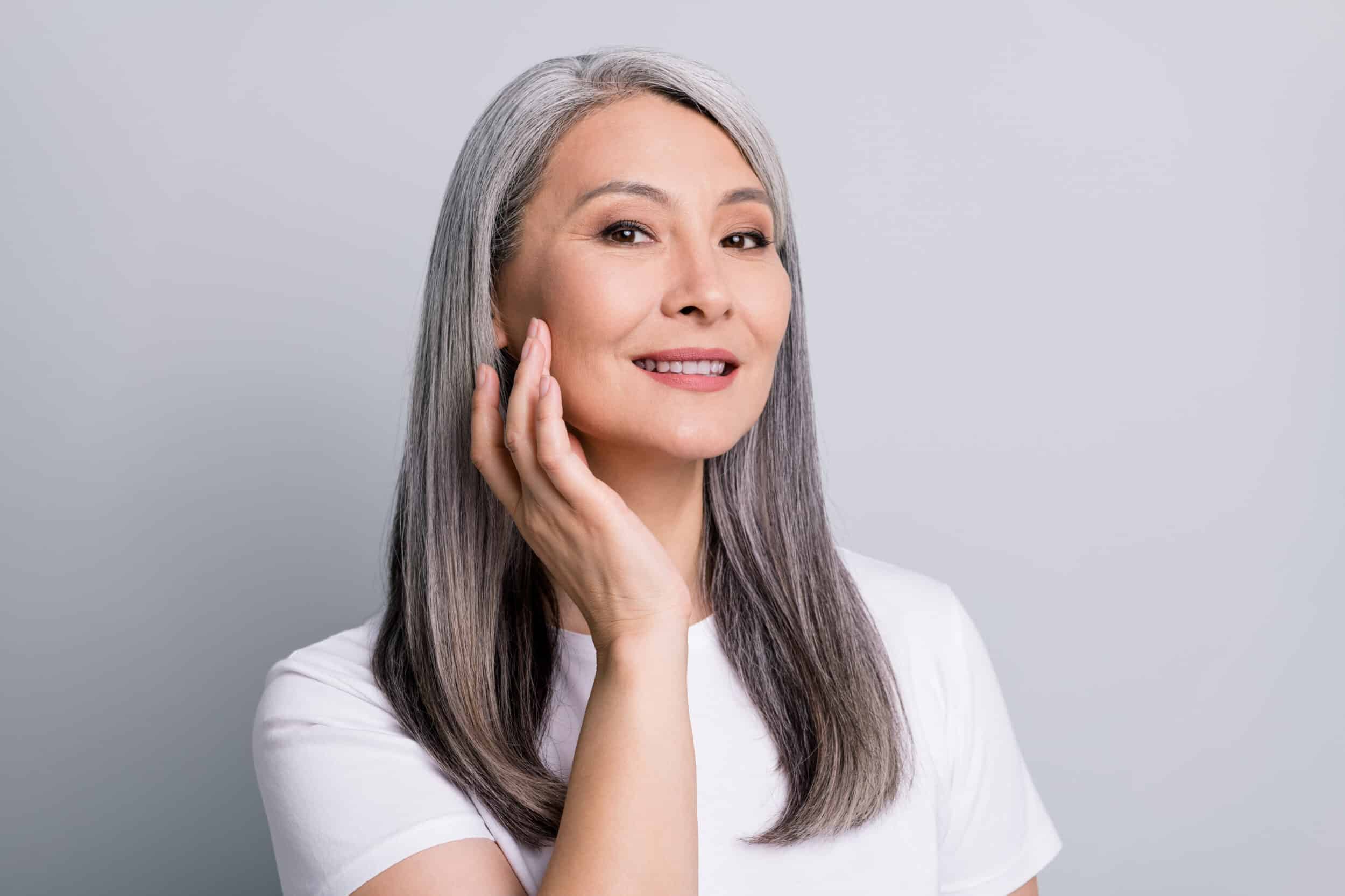 VCl6jrA Portrait of a mature woman with smooth-looking skin.